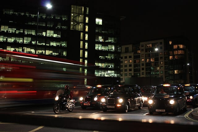 Image of taxis at night in London